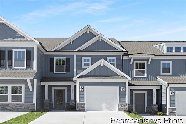 6926 Baler Way Unit 19, Thomasville, NC 27360 - multi unit property with stone siding, concrete driveway, board and batten siding, and a shingled roof