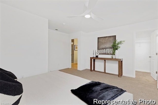 6926 Baler Way Unit 19, Thomasville, NC 27360 - carpeted bedroom featuring a ceiling fan and a spacious closet