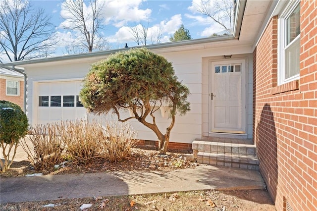 property entrance with a garage