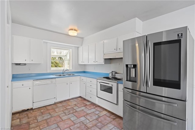 kitchen featuring sink, white cabinets, and white appliances