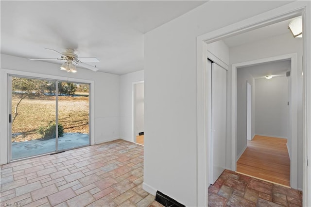 interior space featuring ceiling fan