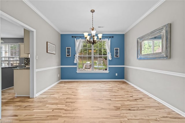 6416 Rock Springs Rd, Greensboro, NC 27410 - unfurnished dining area featuring a chandelier, plenty of natural light, wood finished floors, and ornamental molding
