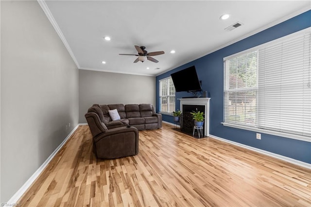 6416 Rock Springs Rd, Greensboro, NC 27410 - living room with light wood-type flooring, ornamental molding, recessed lighting, a ceiling fan, and a fireplace with flush hearth