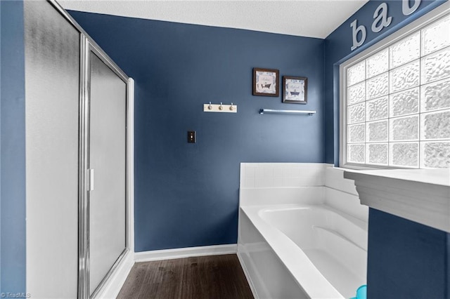 6416 Rock Springs Rd, Greensboro, NC 27410 - full bath featuring a garden tub, wood finished floors, and a shower stall