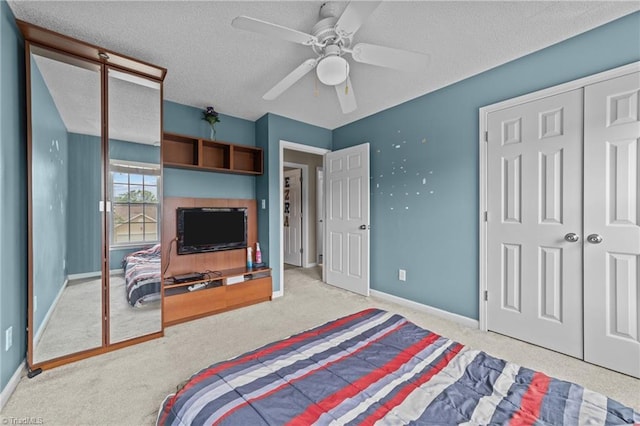 6416 Rock Springs Rd, Greensboro, NC 27410 - bedroom with a textured ceiling, carpet floors, a closet, and ceiling fan