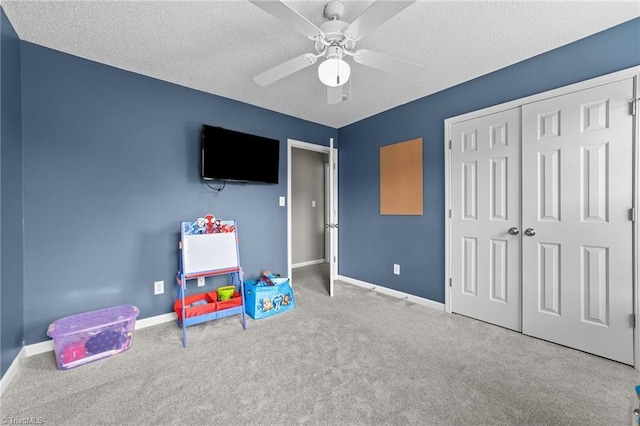 6416 Rock Springs Rd, Greensboro, NC 27410 - rec room with carpet, a textured ceiling, and ceiling fan