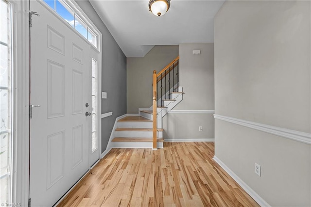 6416 Rock Springs Rd, Greensboro, NC 27410 - foyer entrance with light wood-style flooring and stairs
