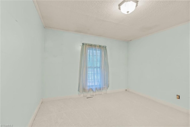 2796 Grant Trl, Randleman, NC 27317 - spare room with a textured ceiling, carpet flooring, and baseboards