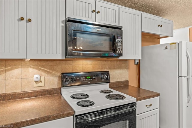 2796 Grant Trl, Randleman, NC 27317 - kitchen featuring electric range oven, black microwave, freestanding refrigerator, and dark countertops