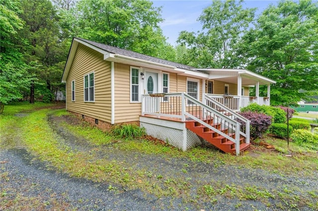 2796 Grant Trl, Randleman, NC 27317 - view of front of home with crawl space, covered porch, and view of scattered trees