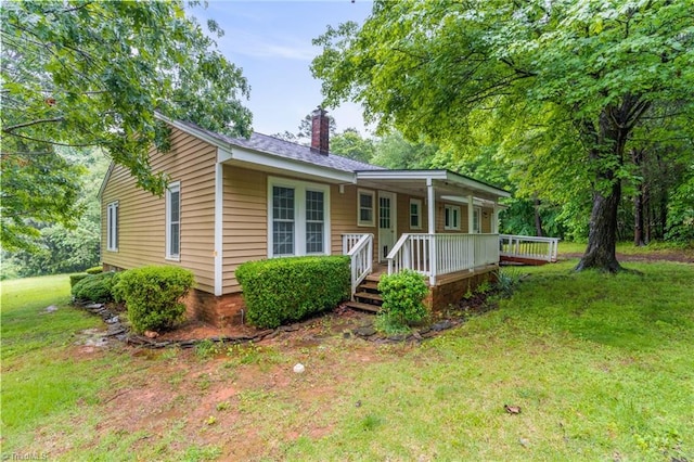 2796 Grant Trl, Randleman, NC 27317 - view of front of property featuring a chimney and a front yard