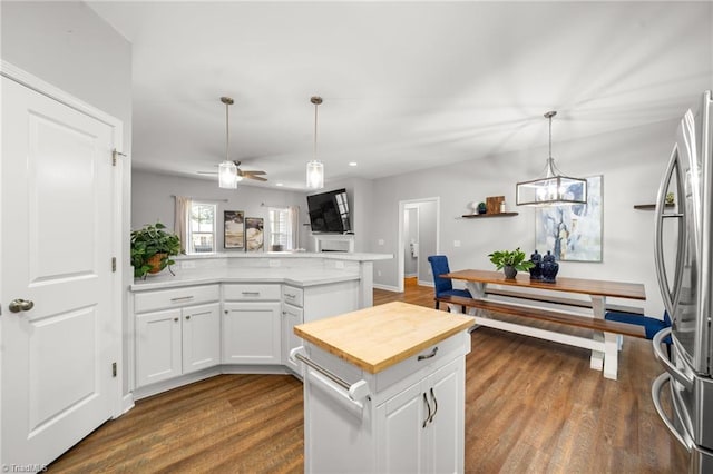 4215 Chippenham Ct, Graham, NC 27253 - kitchen with freestanding refrigerator, a peninsula, white cabinetry, ceiling fan, and recessed lighting