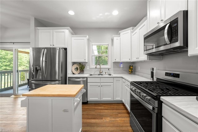4215 Chippenham Ct, Graham, NC 27253 - kitchen featuring appliances with stainless steel finishes, butcher block countertops, a sink, white cabinets, and recessed lighting