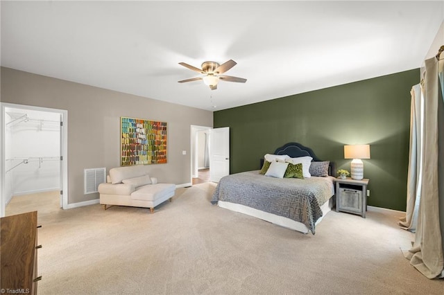 4215 Chippenham Ct, Graham, NC 27253 - bedroom with light carpet, baseboards, a ceiling fan, and a spacious closet