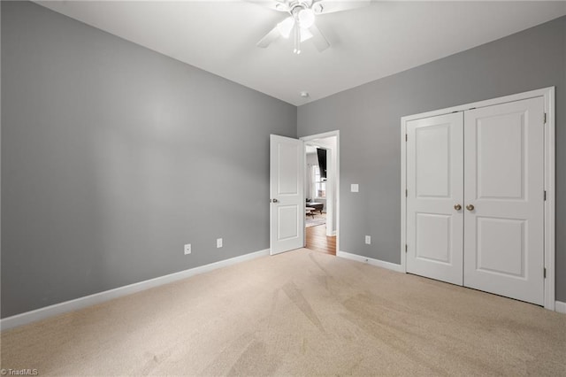 4215 Chippenham Ct, Graham, NC 27253 - unfurnished bedroom featuring carpet, baseboards, a closet, and a ceiling fan