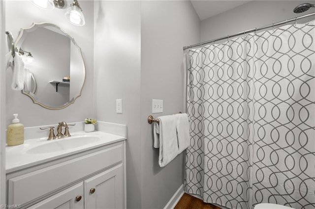 4215 Chippenham Ct, Graham, NC 27253 - full bathroom featuring vanity, curtained shower, toilet, and baseboards