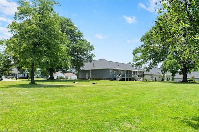 4215 Chippenham Ct, Graham, NC 27253 - view of grassy yard featuring stairs and a deck