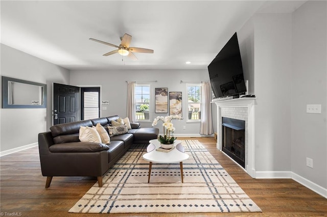 4215 Chippenham Ct, Graham, NC 27253 - living room featuring ceiling fan, baseboards, a brick fireplace, wood finished floors, and recessed lighting