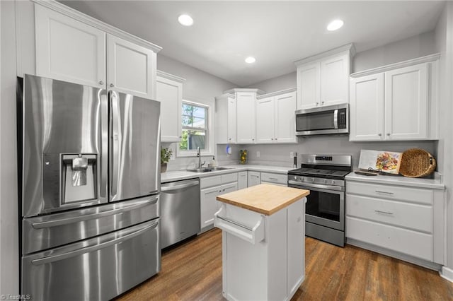 4215 Chippenham Ct, Graham, NC 27253 - kitchen featuring stainless steel appliances, a sink, wooden counters, dark wood-style flooring, and recessed lighting