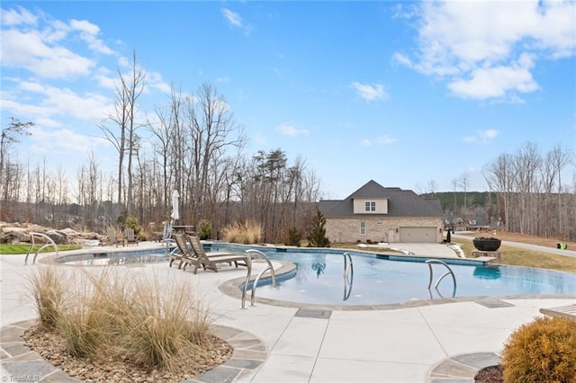 view of pool featuring a patio