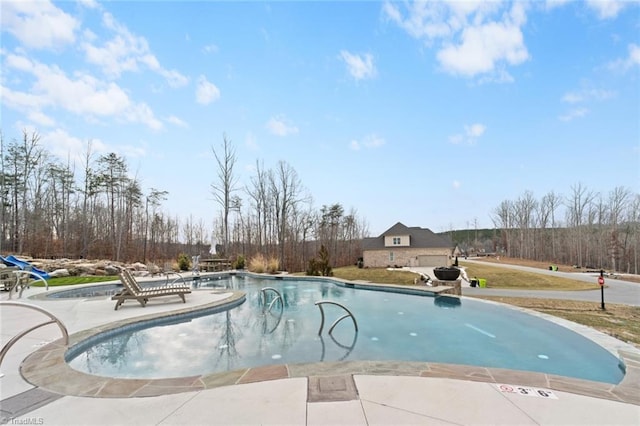 view of pool featuring a patio area