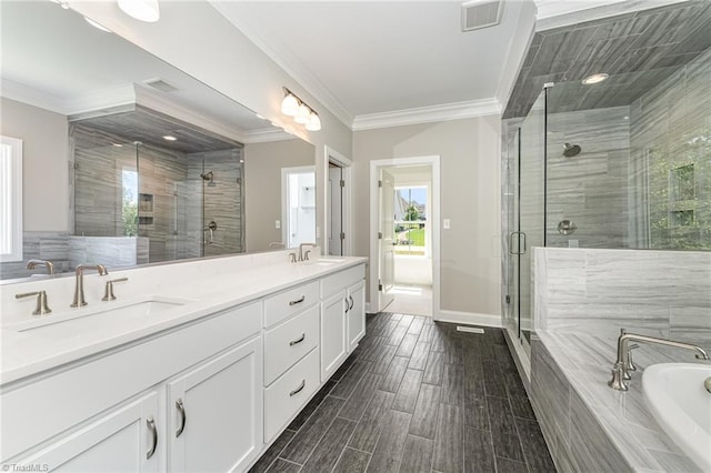 bathroom featuring a sink, visible vents, and crown molding