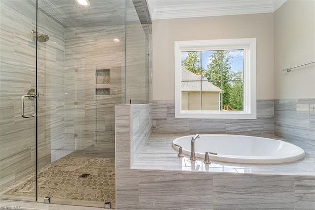 full bathroom with ornamental molding, a stall shower, and a garden tub