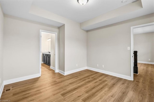 spare room featuring light hardwood / wood-style flooring