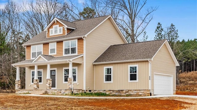 view of front facade with a porch and a garage