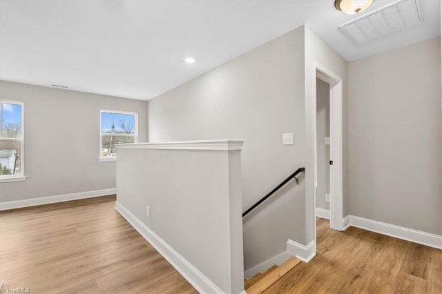 hall with light hardwood / wood-style flooring