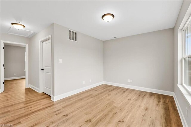 empty room with light wood-type flooring