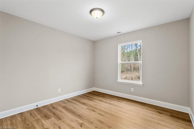 empty room with light hardwood / wood-style floors