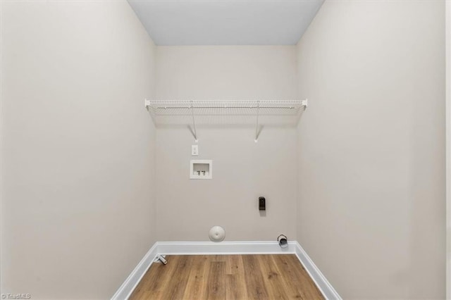 laundry area with washer hookup and hardwood / wood-style flooring