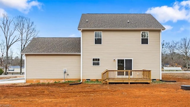 back of property with a wooden deck