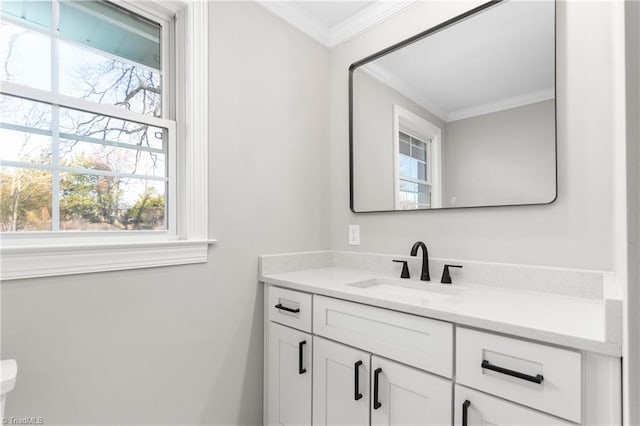 half bath with crown molding and vanity