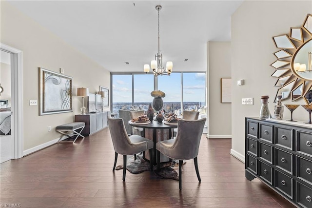 dining room featuring a notable chandelier, expansive windows, and dark hardwood / wood-style flooring