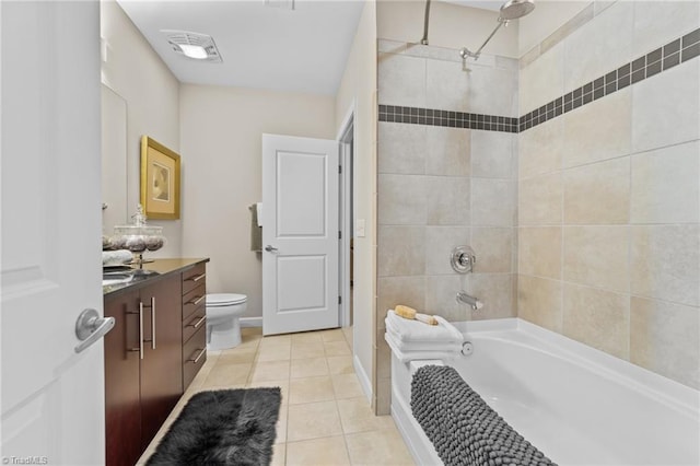 full bathroom with tile patterned flooring, vanity, toilet, and tiled shower / bath