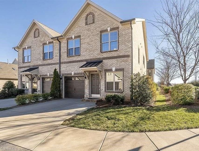 view of front of property with a garage and a front lawn