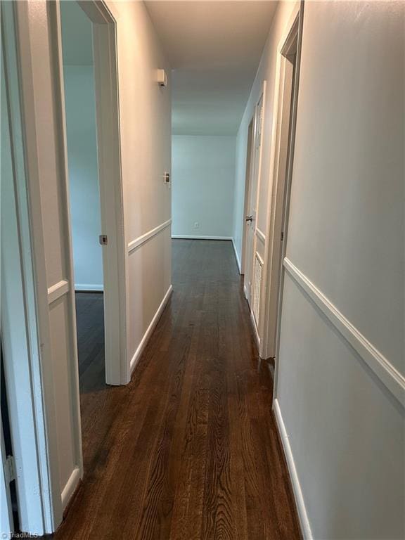 1230 W Sedgefield Dr, Winston-Salem, NC 27107 - corridor featuring dark wood-style flooring and baseboards