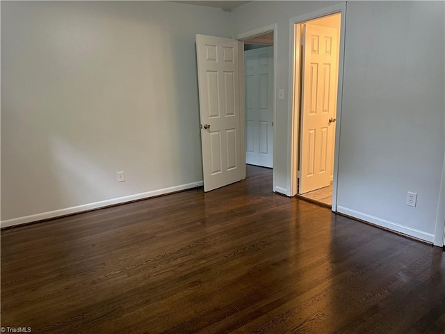 1230 W Sedgefield Dr, Winston-Salem, NC 27107 - unfurnished bedroom featuring dark wood-style flooring and baseboards