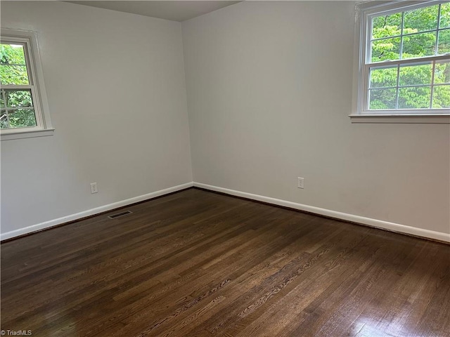 1230 W Sedgefield Dr, Winston-Salem, NC 27107 - empty room featuring baseboards and dark wood-style flooring