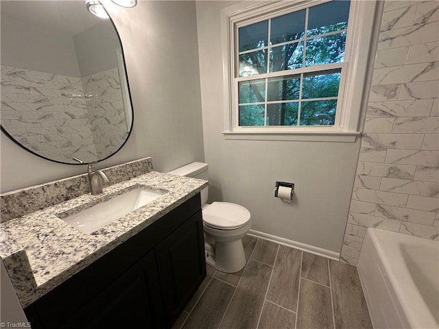1230 W Sedgefield Dr, Winston-Salem, NC 27107 - bathroom with vanity, toilet, and wood tiled floors