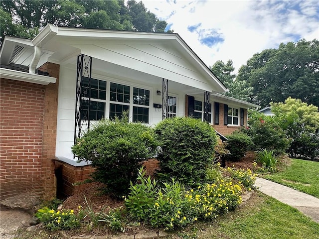 1230 W Sedgefield Dr, Winston-Salem, NC 27107 - view of front of house with brick siding and a porch