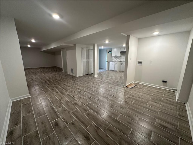 1230 W Sedgefield Dr, Winston-Salem, NC 27107 - finished below grade area with dark wood-style floors, baseboards, and recessed lighting