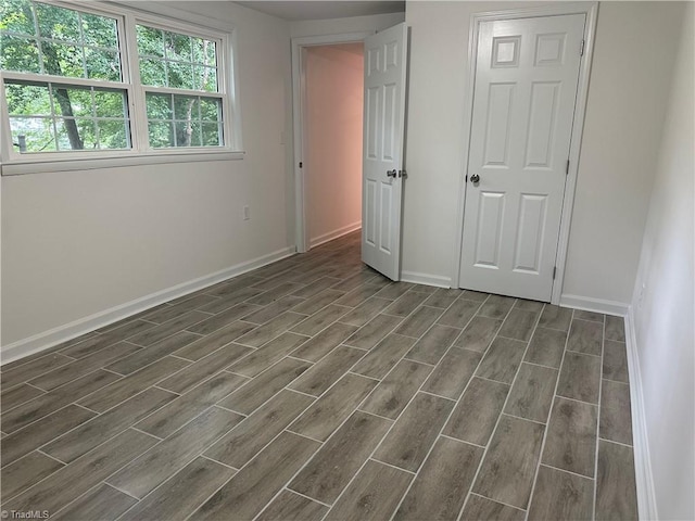 1230 W Sedgefield Dr, Winston-Salem, NC 27107 - unfurnished bedroom featuring wood finish floors and baseboards
