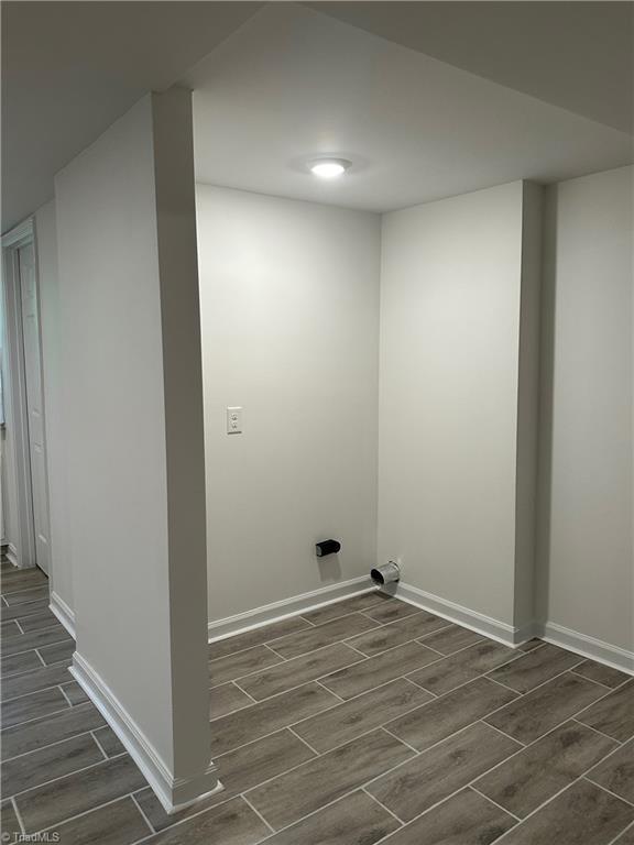 1230 W Sedgefield Dr, Winston-Salem, NC 27107 - washroom with wood tiled floors and baseboards