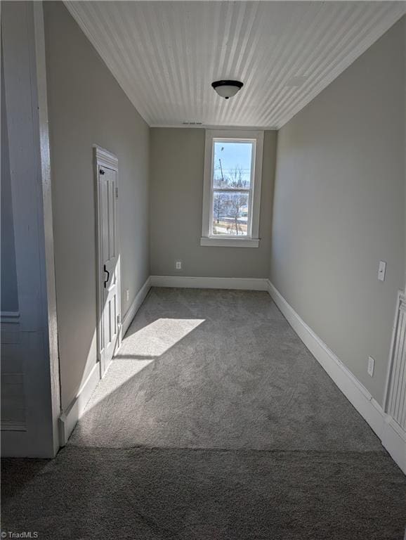 unfurnished room featuring light colored carpet