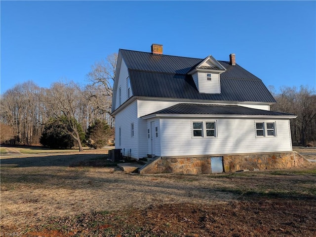 view of side of home featuring central air condition unit