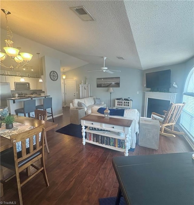1620 Cherry Blossom Ln Unit 301, Winston-Salem, NC 27127 - living area with a textured ceiling, ceiling fan, wood finished floors, a chandelier, and a fireplace