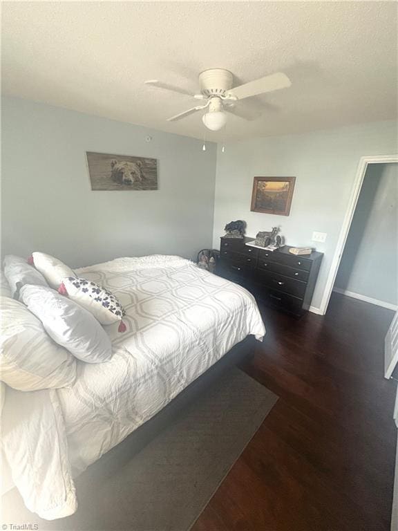 1620 Cherry Blossom Ln Unit 301, Winston-Salem, NC 27127 - bedroom with wood finished floors, a ceiling fan, and a textured ceiling
